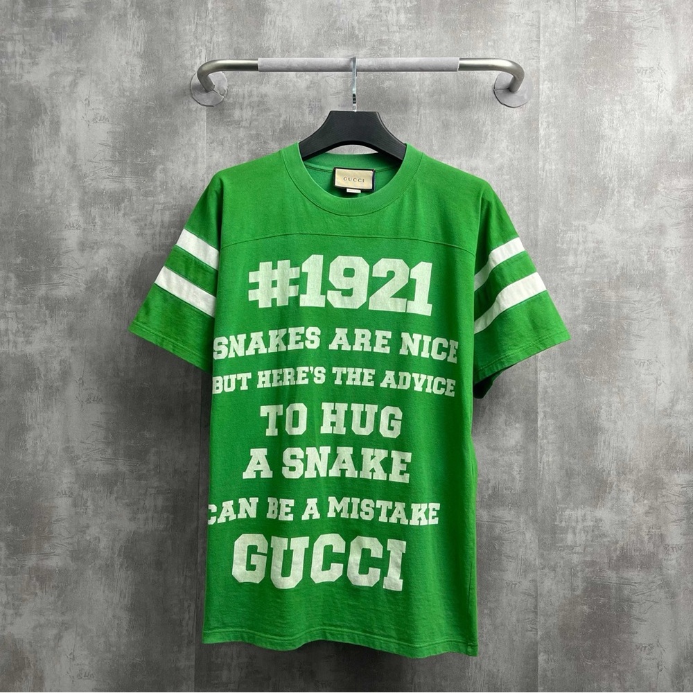 ❌sold❌Authentic Gucci Green T-Shirt with White Text and Stripes